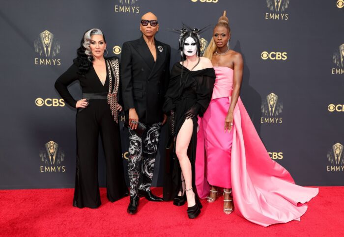 Dressed in eye-catching formalwear, Rupaul, Michelle Visage, Gottmilk and Symone pose on the red carpet. 